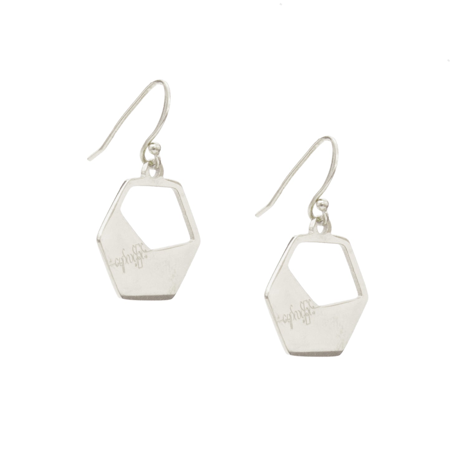 Silver geometric earrings on a white background