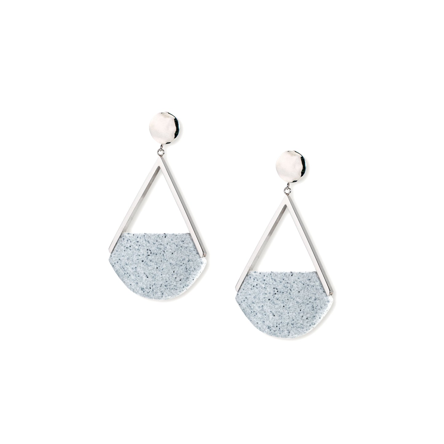 Pair of earrings with triangular design and speckled texture on a white background