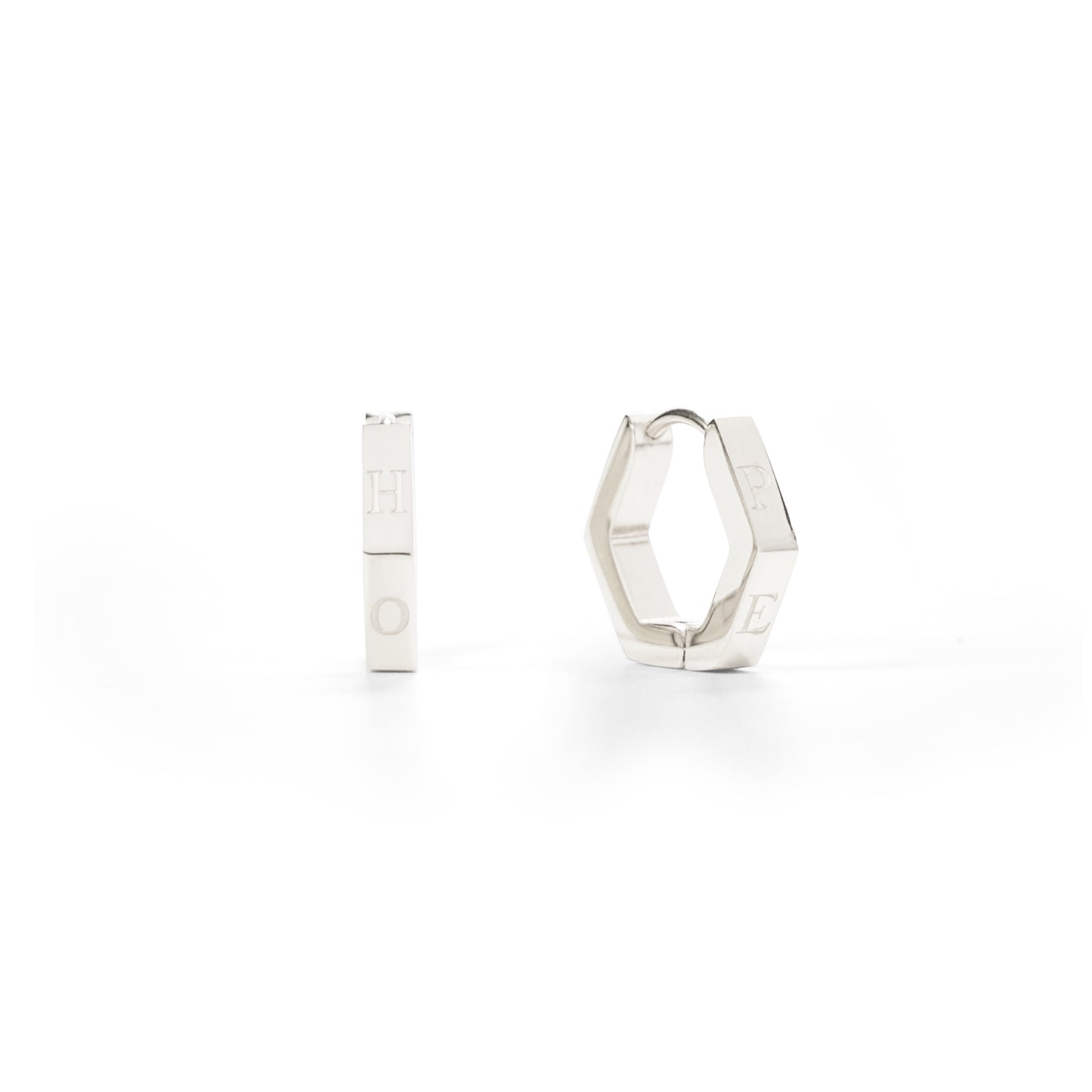 Silver hoop earrings on a white background