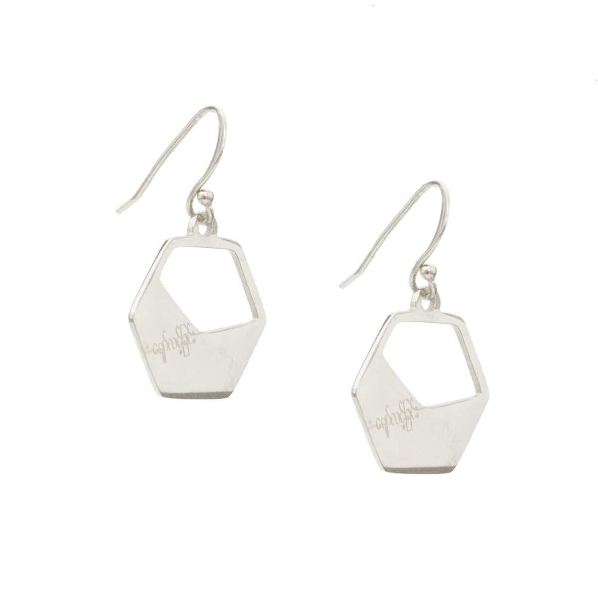 Silver geometric earrings on a white background