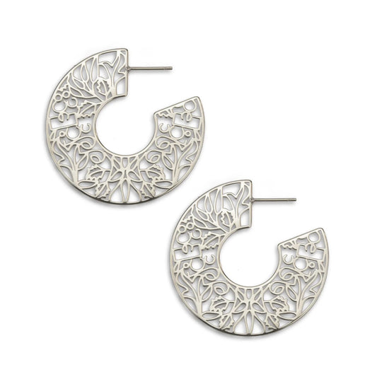 Silver hoop earrings with intricate patterns on a white background