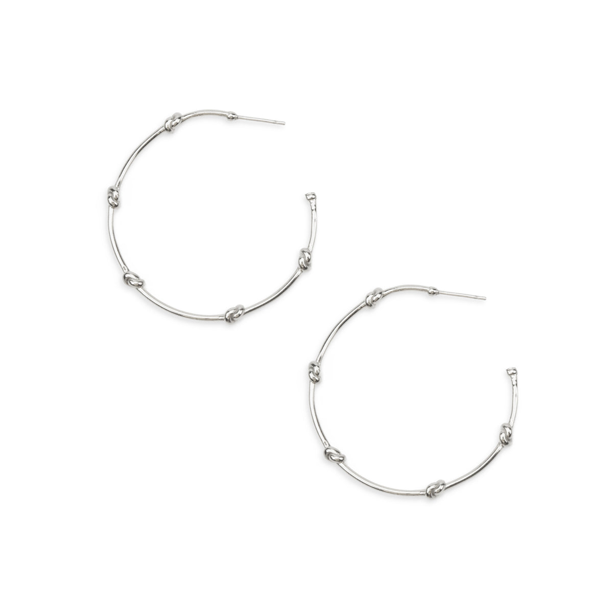 Silver hoop earrings on a white background