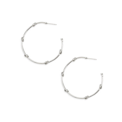 Silver hoop earrings on a white background