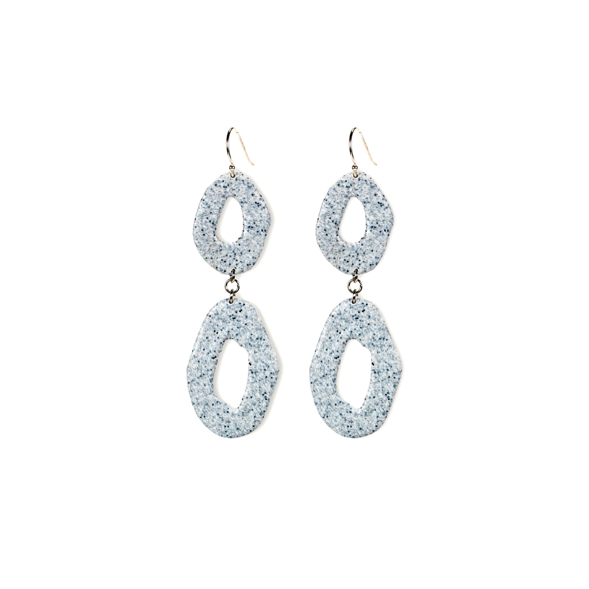 Pair of glittery silver earrings on a white background