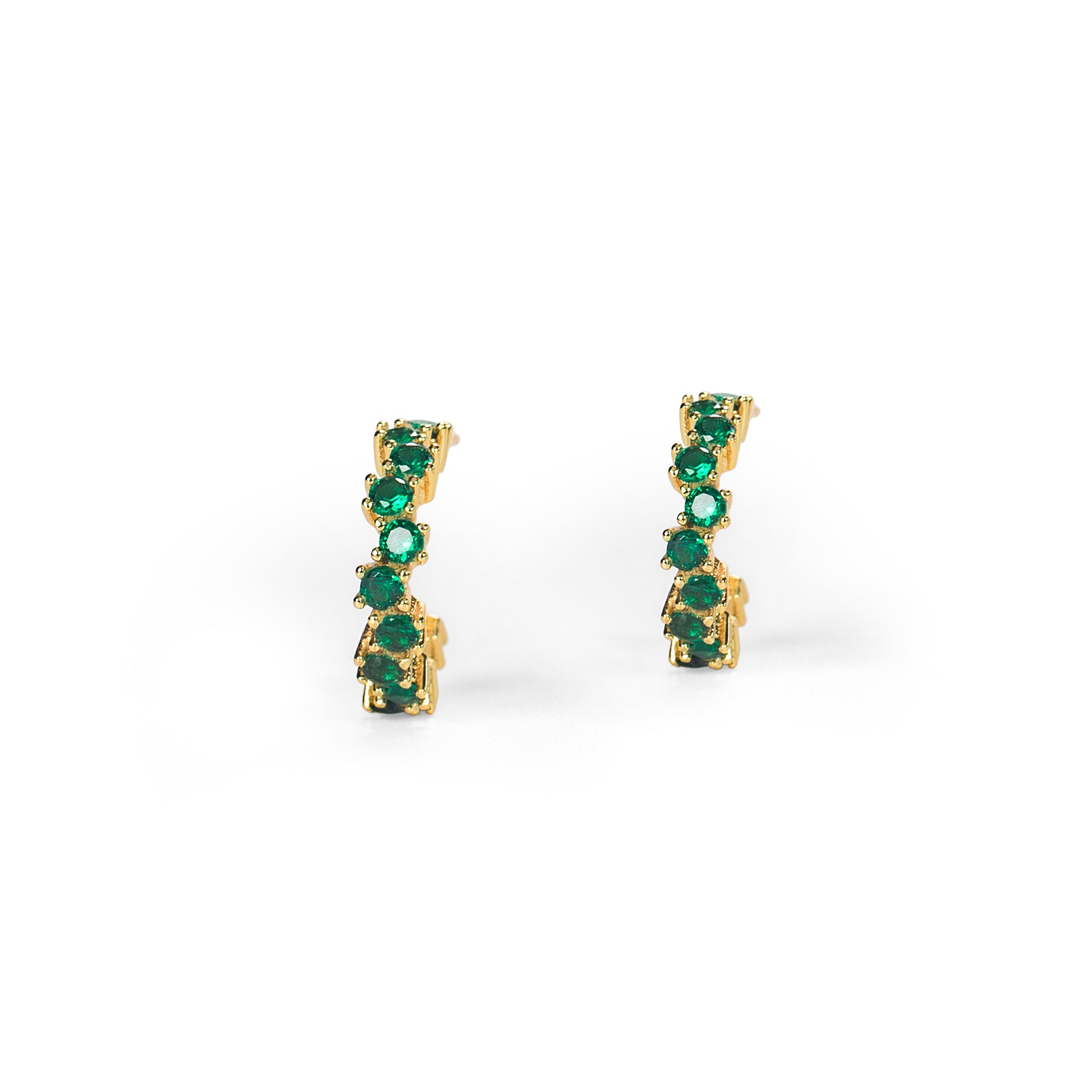Pair of gold earrings with green gemstones on a white background