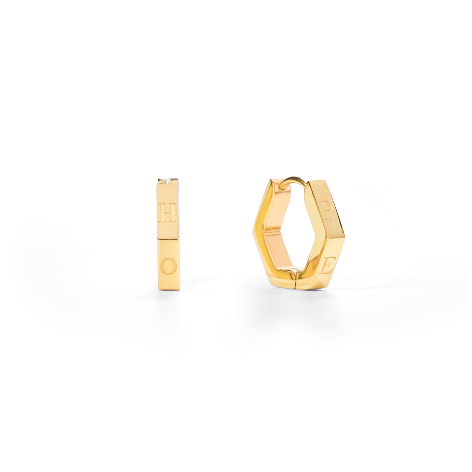 Gold hoop earrings on a white background