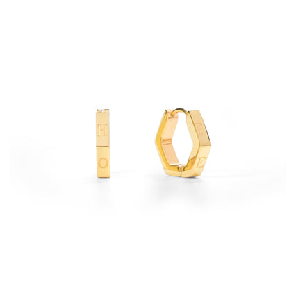Gold hoop earrings on a white background