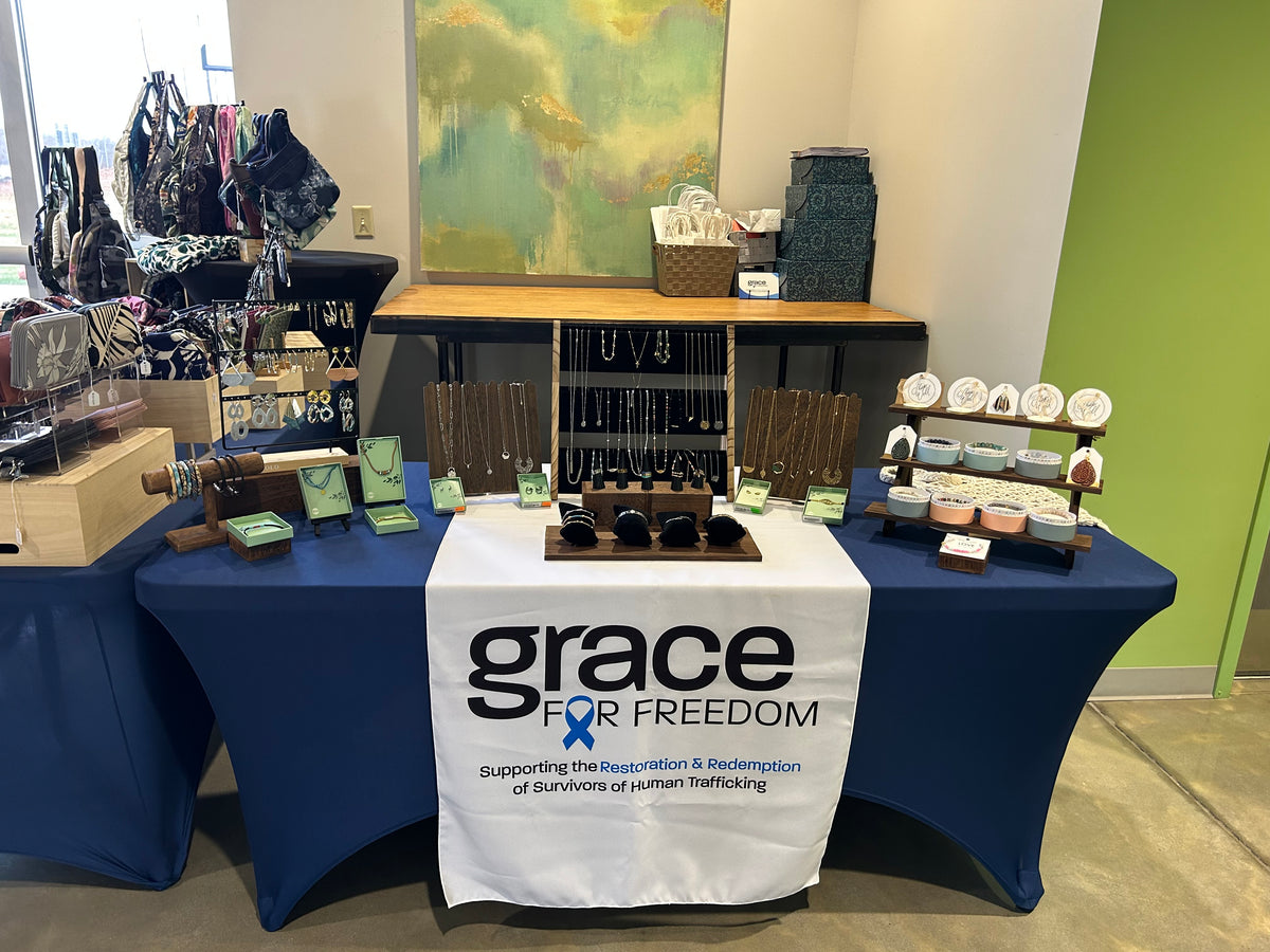table with products and banner that reads Grace for Freedom