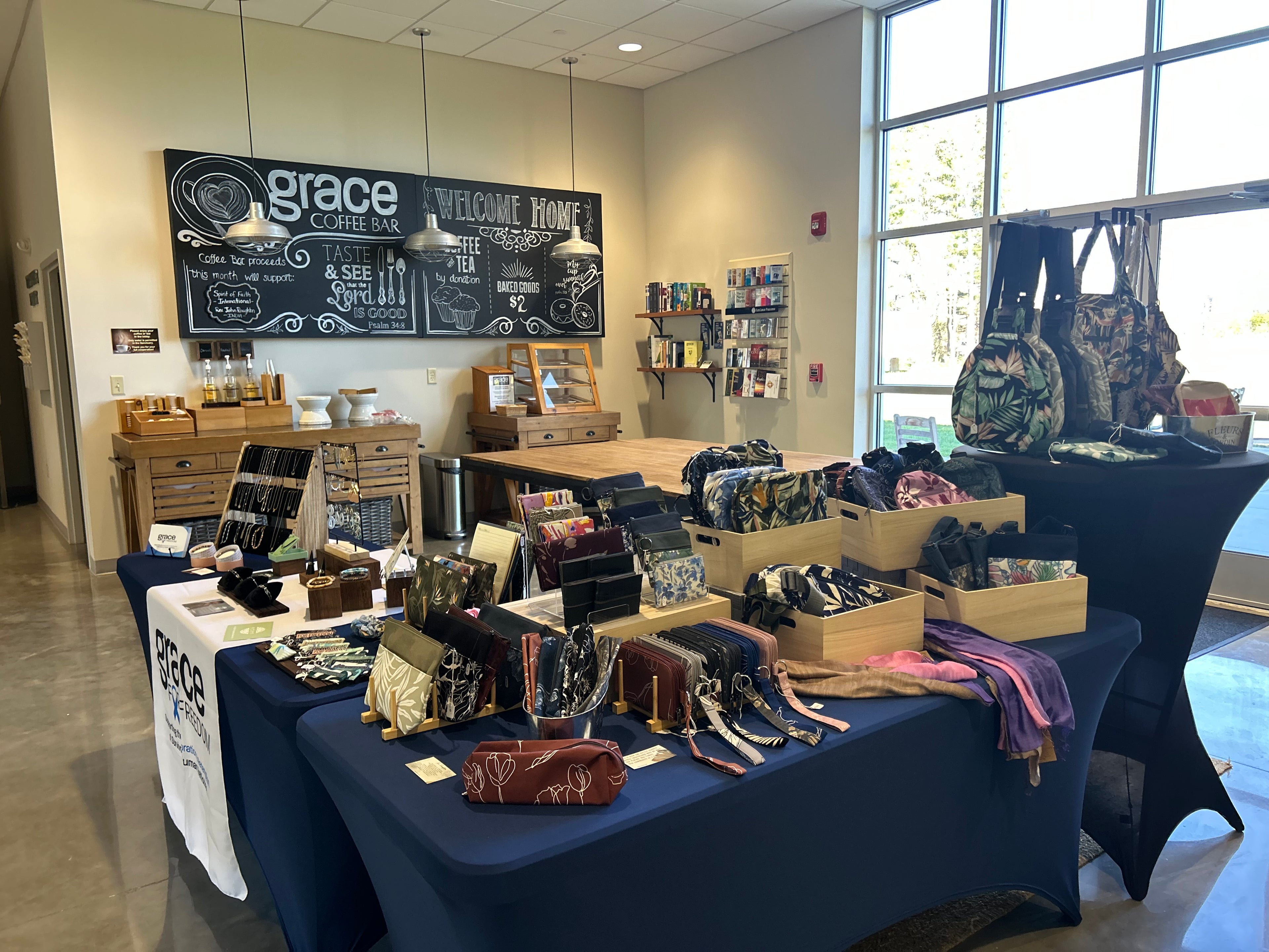tables with bags and wallets for sale