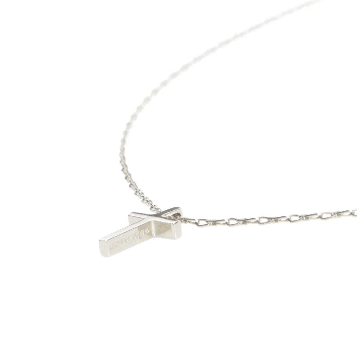Silver necklace with a small pendant on a white background