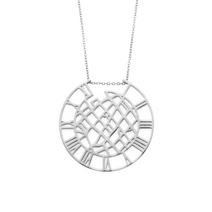 Silver necklace with a circular pendant on a white background