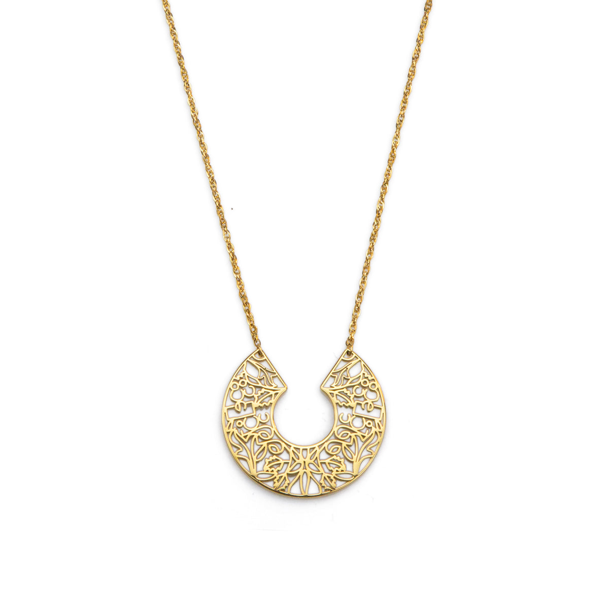 Gold necklace with a intricate pendant on a white background