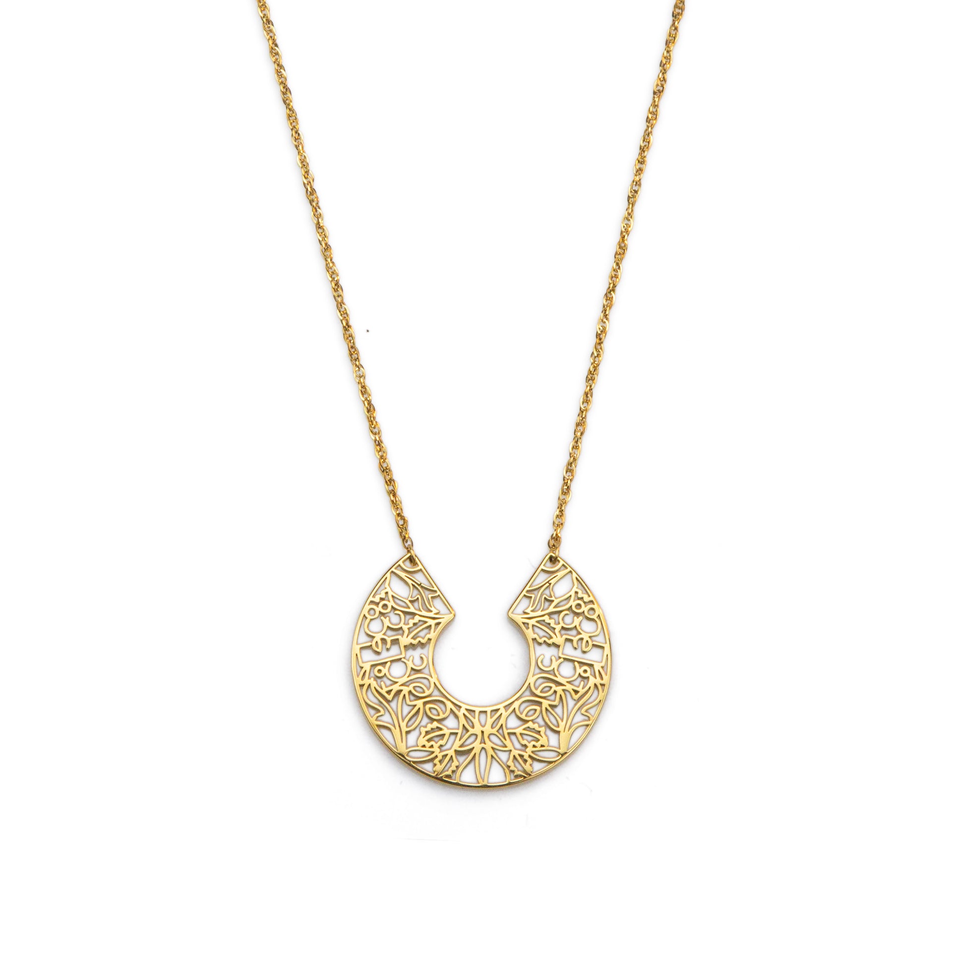 Gold necklace with a intricate pendant on a white background