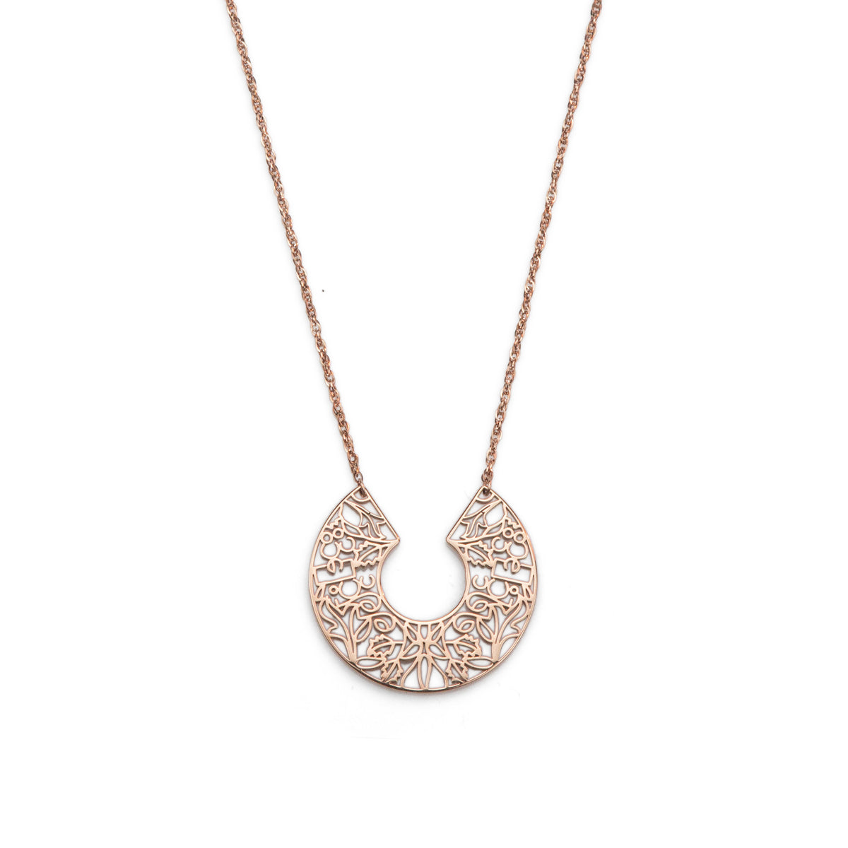 Rose gold necklace with a intricate pendant on a white background