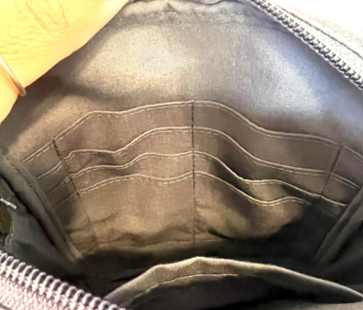 Close-up of a dark gray fabric interior with stitching details