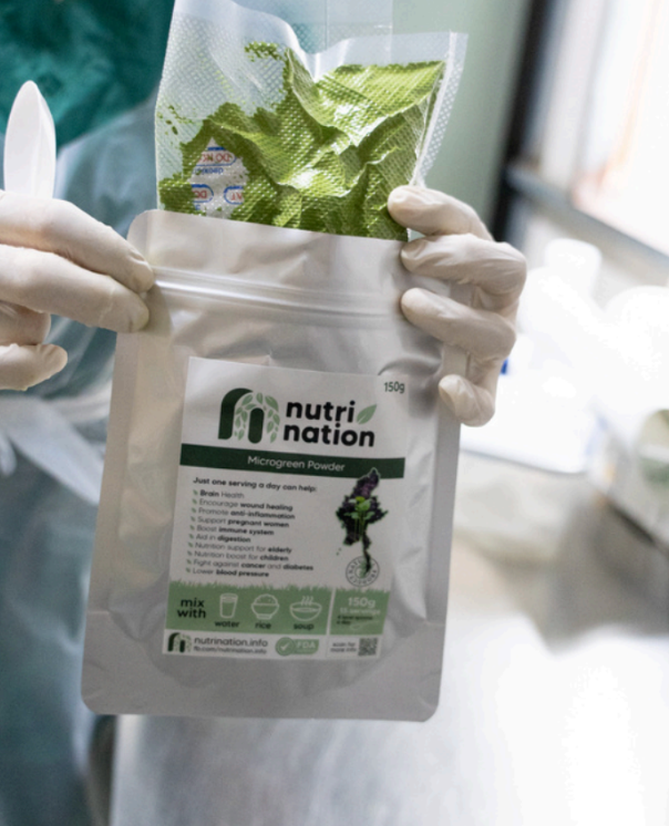 person holding bag of vacuum sealed leaf food product