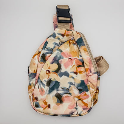 Floral patterned sling bag on a light gray background