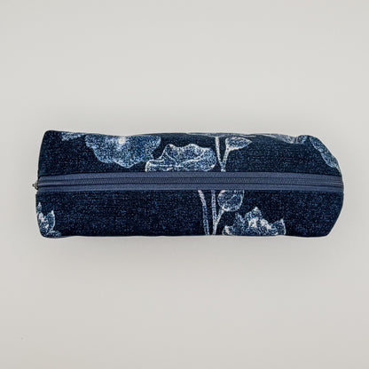 Pencil case with floral pattern and zipper on a light gray background