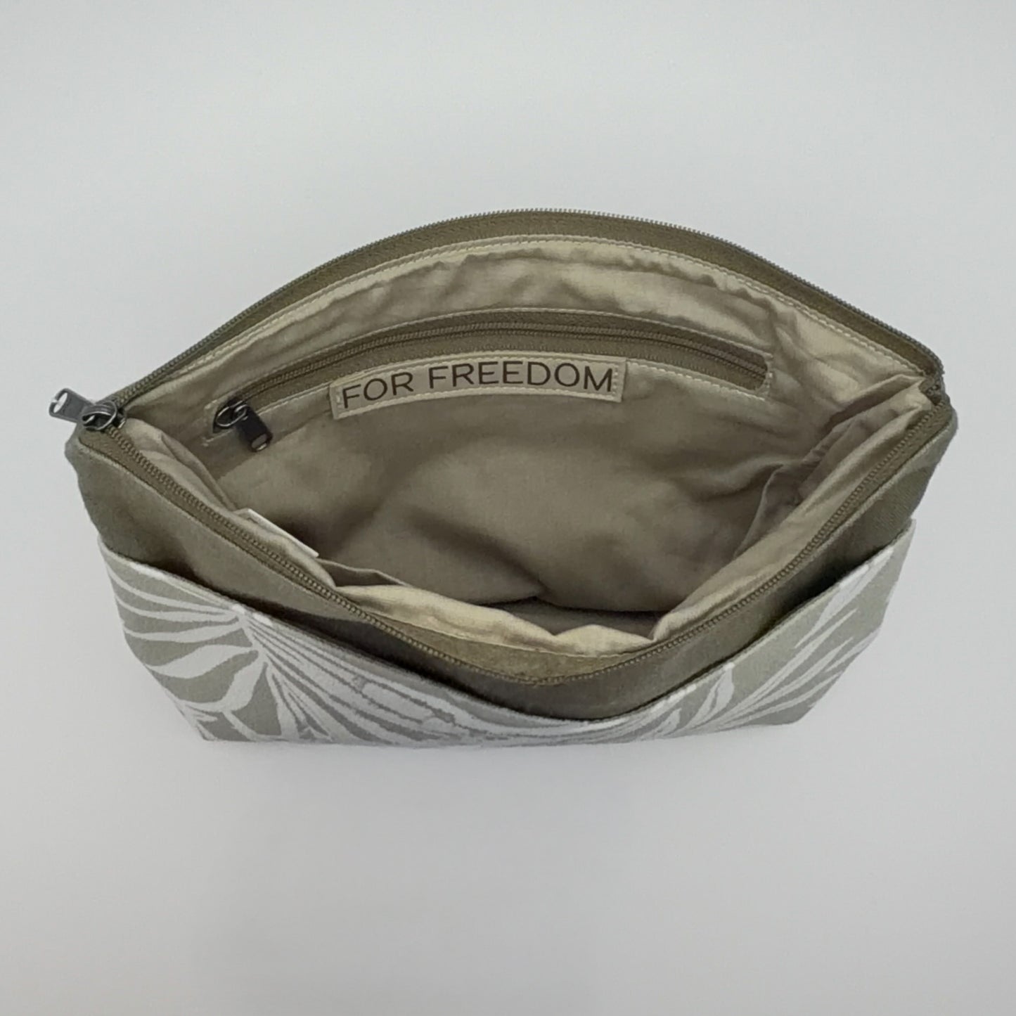 Open pouch with 'For Freedom' label on a light gray background