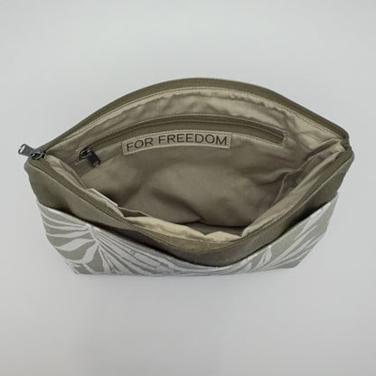 Open pouch with 'For Freedom' label on a light gray background