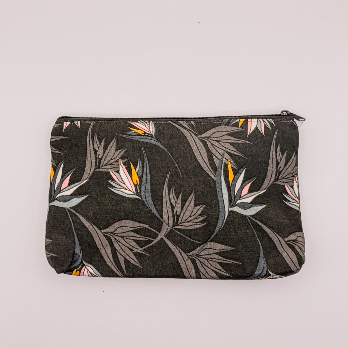Floral-patterned pouch on a light gray background