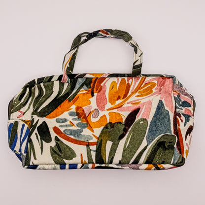Floral patterned bag on a light gray background